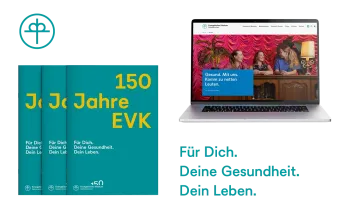 Festschrift und aufgeklappter Laptop mit Website des EvK Gelsenkirchen